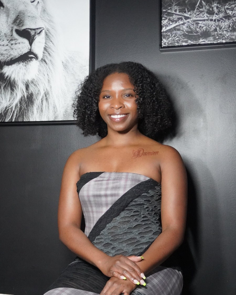 Taylor Tatum seated in her tattoo studio.